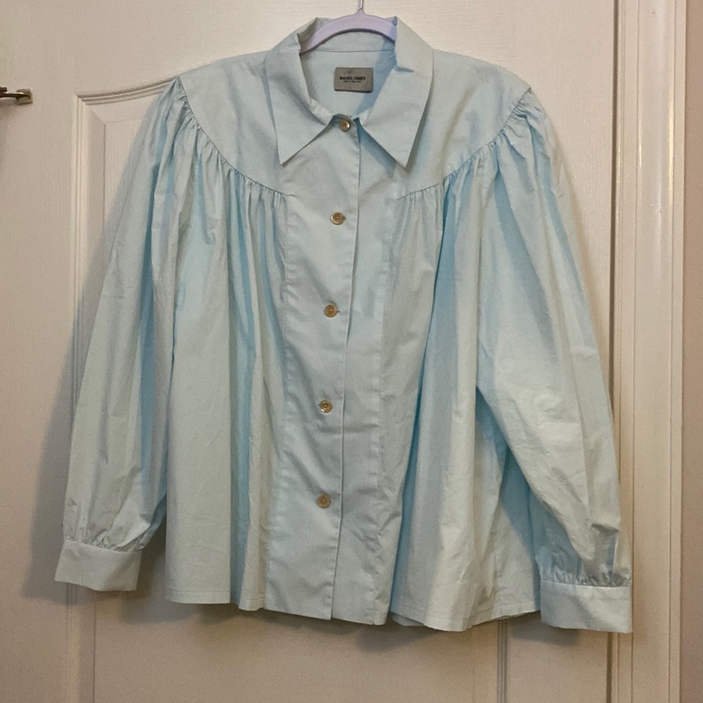 Button up , puffed sleeved blouse.  Never worn but took tags off before trying o
